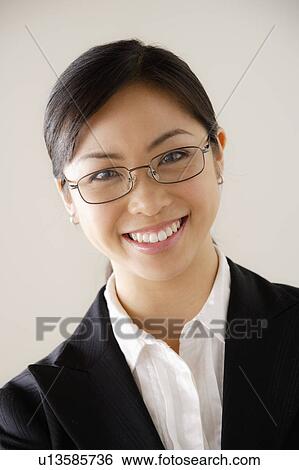 Stock Photograph - Portrait of young smiling businesswoman. Fotosearch