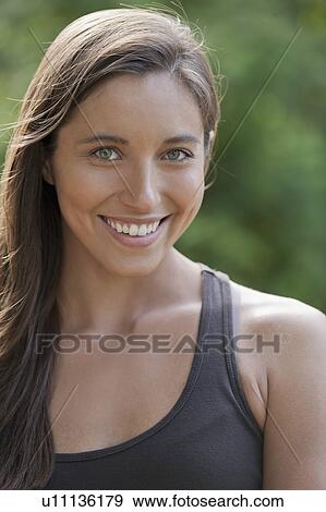 Portrait of young woman smiling View Large Photo Image Stock Photo - Portrait of young woman smiling. Fotosearch