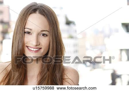 Stock Photo - Portrait of young woman smiling. Fotosearch