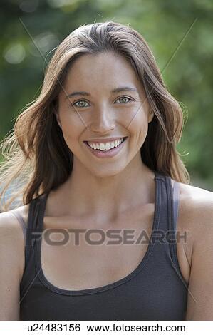 Portrait of young woman smiling View Large Photo Image Stock Photograph - Portrait of young woman smiling. Fotosearch