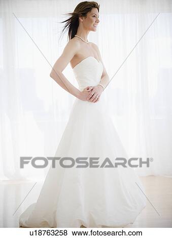 Portrait ofs miling woman in wedding dress View Large Photo Image Stock Photo - Portrait ofs miling woman in wedding dress. Fotosearch