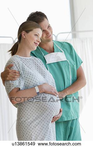 Pregnant woman with partner in hospital View Large Photo Image Stock Photo - Pregnant woman with partner in hospital. Fotosearch