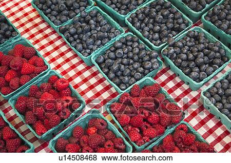 Stock Photo - Raspberries and blueberries in cartons. Fotosearch