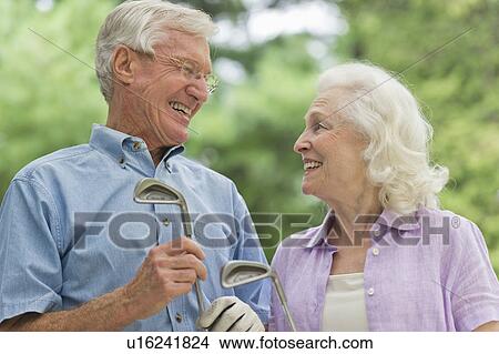 Senior couple playing golf View Large Photo Image Picture - Senior couple playing golf. Fotosearch