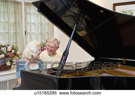 Stock Photography - Senior couple playing piano. Fotosearch