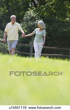 Stock Photo - Senior couple walking together. Fotosearch