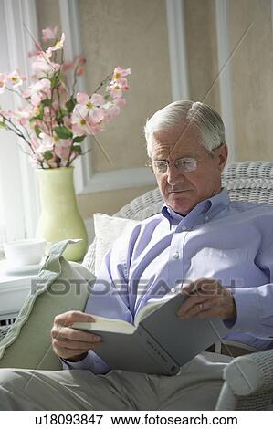 Senior man reading book View Large Photo Image Stock Photo - Senior man reading book. Fotosearch