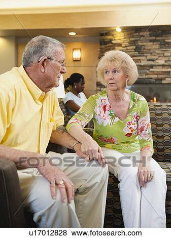 Senior people holding hands in hospital View Large Photo Image Stock Photo - Senior people holding hands in hospital. Fotosearch