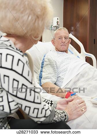 Stock Image - Senior people in hospital. Fotosearch