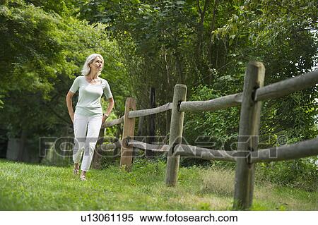 Senior woman walking View Large Photo Image Stock Photography - Senior woman walking. Fotosearch