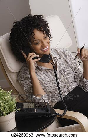 Smiling businesswoman on phone View Large Photo Image Stock Image - Smiling businesswoman on phone. Fotosearch