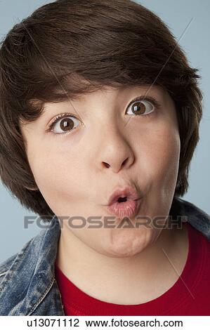 Studio portrait of boy (10-11) making a face View Large Photo Image Stock Image - Studio portrait of boy (10-11) making a face. Fotosearch