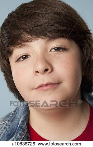 Stock Photography - Studio portrait of boy (10-11). Fotosearch
