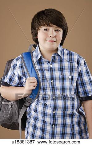 Studio portrait of boy (10-11) wearing backpack View Large Photo Image Stock Photo - Studio portrait of boy (10-11) wearing backpack. Fotosearch