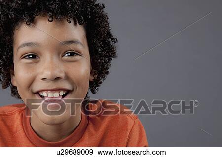 Studio portrait of boy (8-9) View Large Photo Image Stock Photo - Studio portrait of boy (8-9). Fotosearch