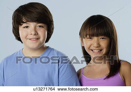 Studio portrait of boy and girl (10-11) View Large Photo Image Picture - Studio portrait of boy and girl (10-11). Fotosearch