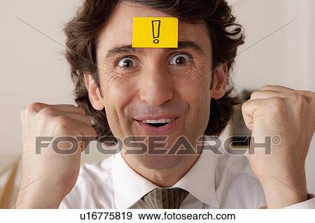 Studio portrait of businessman with adhesive note on forehead View Large Photo Image Stock Photo - Studio portrait of businessman with adhesive note on forehead. Fotosearch