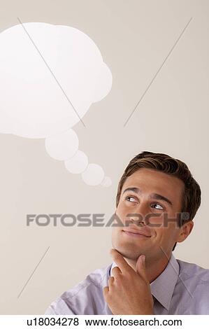 Studio portrait of businessman with thought bubble View Large Photo Image Stock Photo - Studio portrait of businessman with thought bubble. Fotosearch