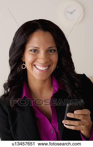 Studio portrait of businesswoman text-messaging View Large Photo Image Stock Image - Studio portrait of businesswoman text-messaging. Fotosearch
