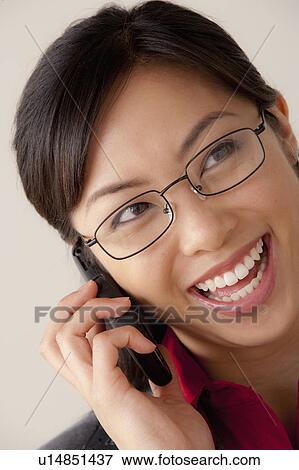 Studio portrait of businesswoman talking on cell phone View Large Photo Image Stock Photo - Studio portrait of businesswoman talking on cell phone. Fotosearch