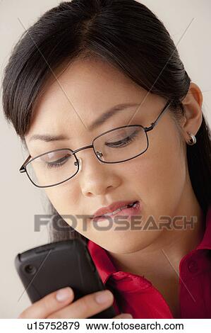 Studio portrait of businesswoman text-messaging View Large Photo Image Stock Photo - Studio portrait of businesswoman text-messaging. Fotosearch