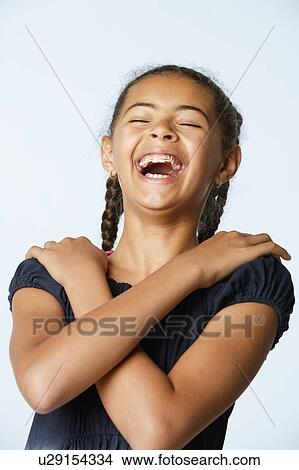 Studio portrait of girl (10-11) laughing View Large Photo Image Picture - Studio portrait of girl (10-11) laughing. Fotosearch