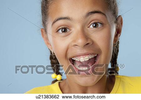 Studio portrait of girl (10-11) laughing View Large Photo Image Stock Image - Studio portrait of girl (10-11) laughing. Fotosearch