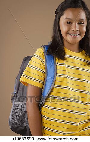Studio portrait of girl (10-11) wearing backpack View Large Photo Image Stock Image - Studio portrait of girl (10-11) wearing backpack. Fotosearch