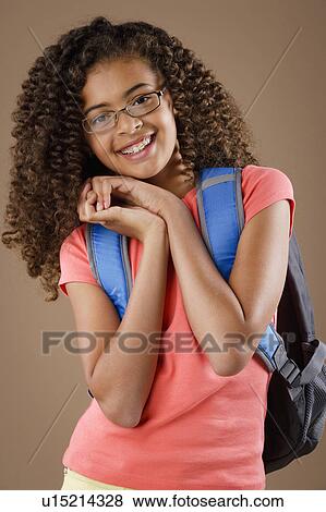 Studio portrait of girl (10-11) wearing backpack View Large Photo Image Stock Photo - Studio portrait of girl (10-11) wearing backpack. Fotosearch