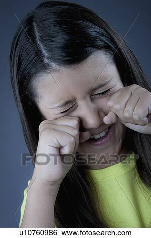 Studio portrait of girl (8-9) crying View Large Photo Image Stock Photograph - Studio portrait of girl (8-9) crying. Fotosearch