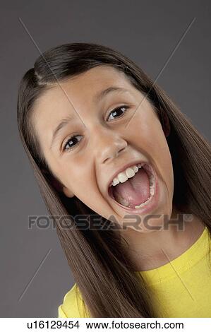 Studio portrait of girl (8-9) screaming View Large Photo Image Picture - Studio portrait of girl (8-9) screaming. Fotosearch