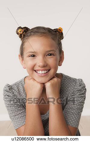Stock Image - Studio portrait of girl (8-9). Fotosearch