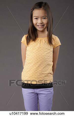 Studio portrait of girl (8-9) View Large Photo Image Stock Photo - Studio portrait of girl (8-9). Fotosearch
