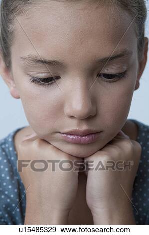 Studio portrait of girl (8-9) View Large Photo Image Stock Photo - Studio portrait of girl (8-9). Fotosearch