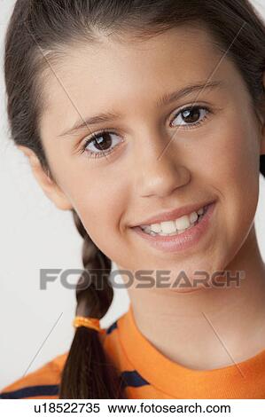 Stock Photography - Studio portrait of girl (8-9). Fotosearch