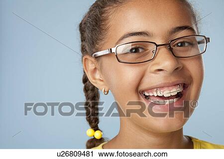 Studio portrait of girl laughing (10-11) View Large Photo Image Stock Image - Studio portrait of girl laughing (10-11). Fotosearch