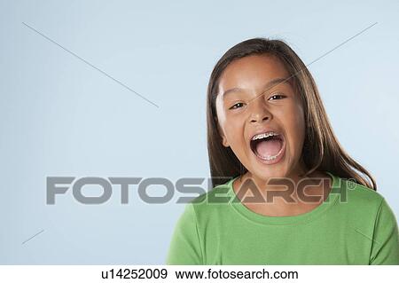 Studio portrait of girl shouting (10-11) View Large Photo Image Stock Photo - Studio portrait of girl shouting (10-11). Fotosearch