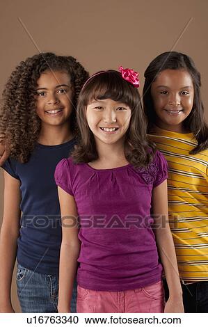 Studio portrait of three girls (10-11) View Large Photo Image Stock Image - Studio portrait of three girls (10-11). Fotosearch