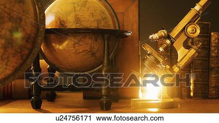 Studio shot of antique globes and microscope View Large Photo Image Stock Image - Studio shot of antique globes and microscope. Fotosearch