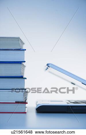 Stock Photo - Studio shot of books and laptop. Fotosearch