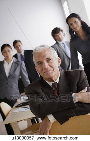Studio shot of business people View Large Photo Image Stock Photo - Studio shot of business people. Fotosearch