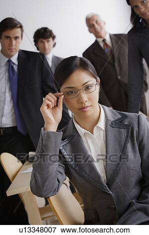 Stock Photo - Studio shot of business people. Fotosearch