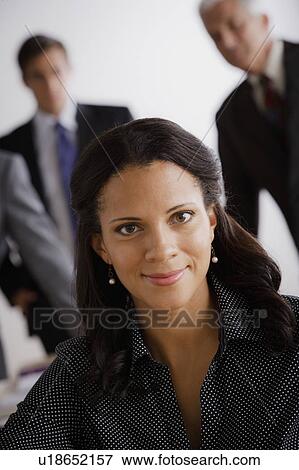 Stock Photo - Studio shot of business people. Fotosearch