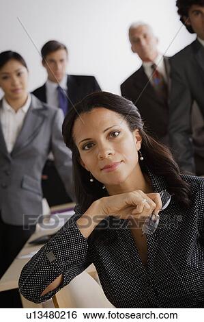 Studio shot of business people View Large Photo Image Stock Photograph - Studio shot of business people. Fotosearch