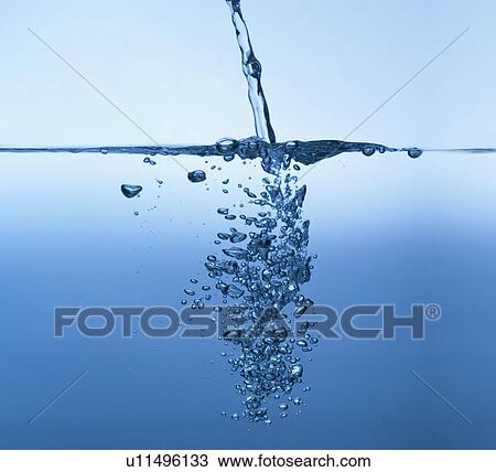 Stock Image - Studio shot of clear blue water. Fotosearch