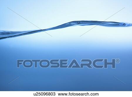 Stock Image - Studio shot of clear blue water. Fotosearch