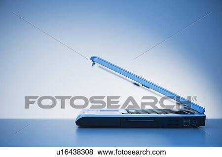 Studio shot of closed laptop View Large Photo Image Stock Photo - Studio shot of closed laptop. Fotosearch
