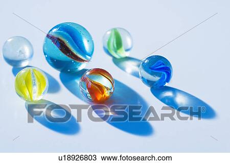 Stock Image - Studio shot of colorful marbles. Fotosearch