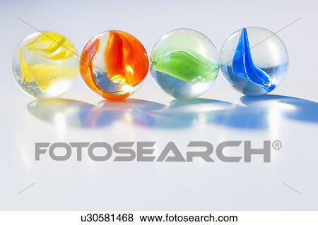 Stock Photo - Studio shot of colorful marbles. Fotosearch