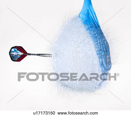 Studio shot of dart puncturing balloon filled with water View Large Photo Image Stock Image - Studio shot of dart puncturing balloon filled with water. Fotosearch